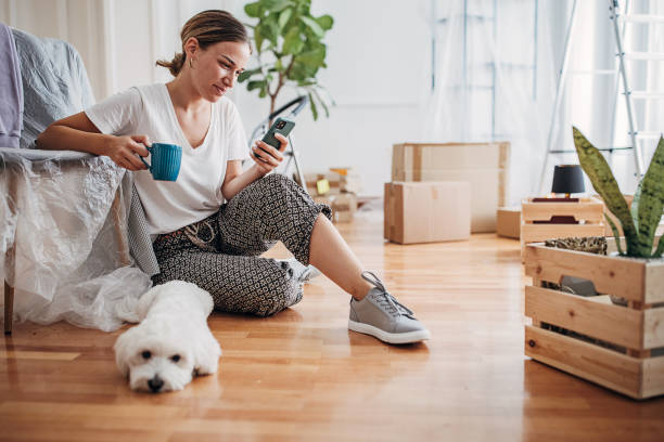 istock Woman sitting in new home 1424245268