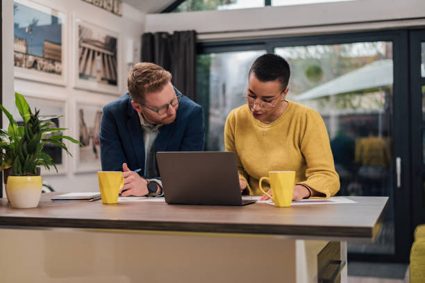 istock Hardworking business partners, working from home, helping each other. 1424245760