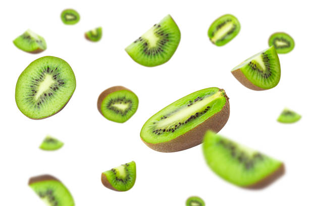 istock Creative falling kiwi fruit layout. Food concept. copy space. Kiwi in flight background for design and packaging. flat lay 1424247741