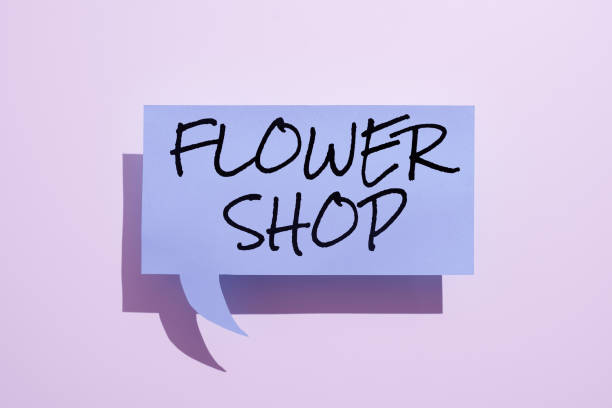 istock Handwriting text Flower Shop. Business overview where cut flowers are sold with decorations for gifts 1424248564