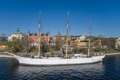 Af Chapman and Admiralty House. Full-rigged Steel Ship Moored on the Western Shore of the Islet Skeppsholmen in Central Stockholm, Sweden, Now Serving as a Youth Hostel