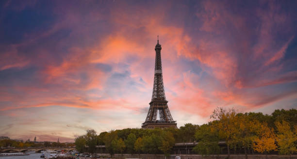 istock The Eiffel Tower, iconic Paris landmark  as autumn trees park  as Seine river with sunset sky scene in Paris ,France 1424257917