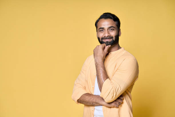 istock Confident bearded indian man standing isolated on yellow background. 1424261850