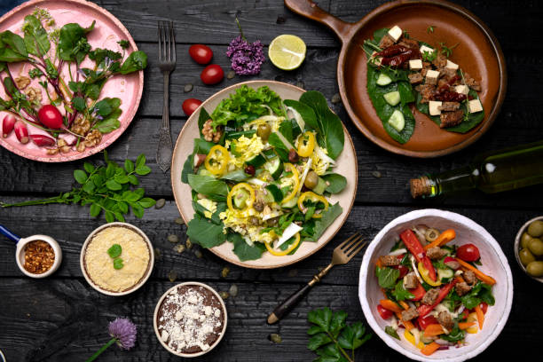 istock Dinner Table with mix of dishes 1424262565