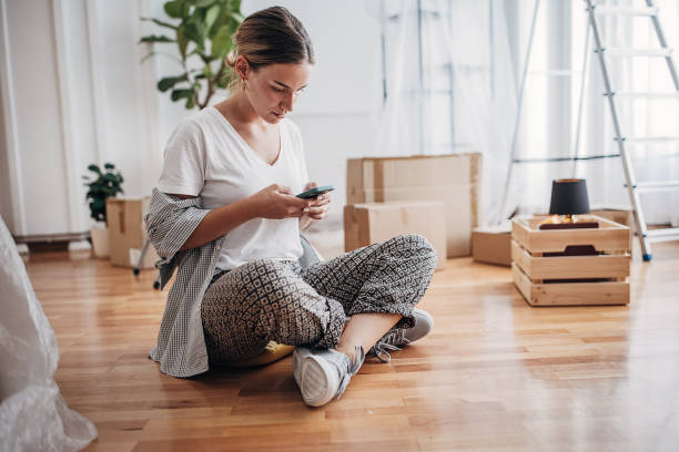 istock Woman sitting in new home 1424264897