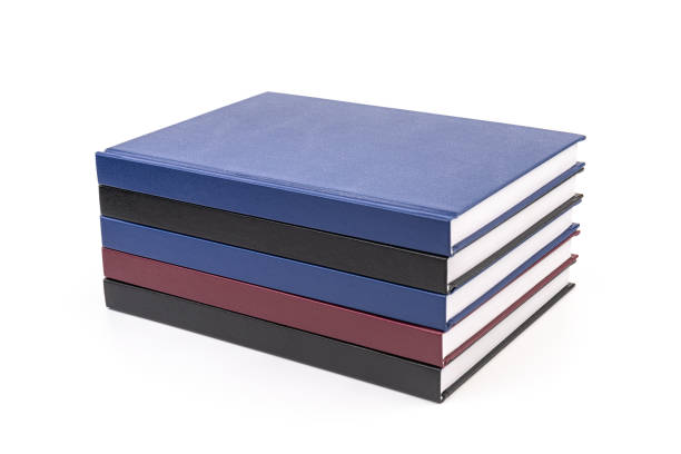 istock Stacked hardcover notebooks on white background. Education business concept. 1424264908