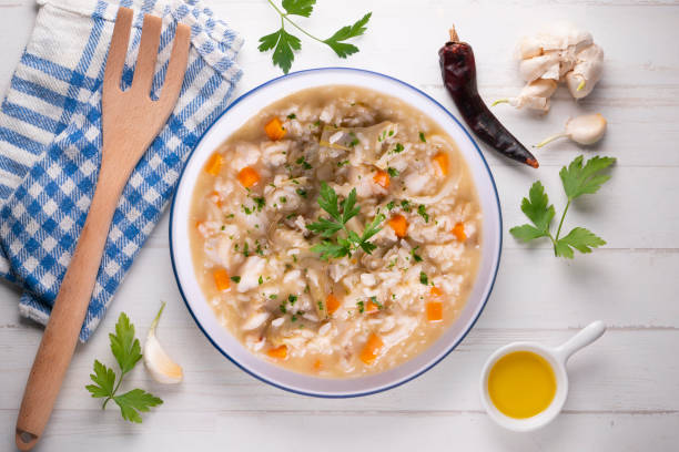 istock Soupy rice with artichokes and carrots. Typical Spanish gastronomy platter. 1424269181