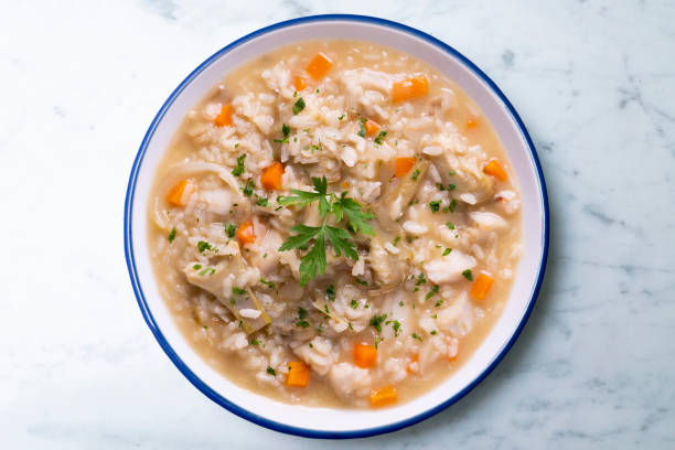 istock Soupy rice with artichokes and carrots. Typical Spanish gastronomy platter. 1424269187