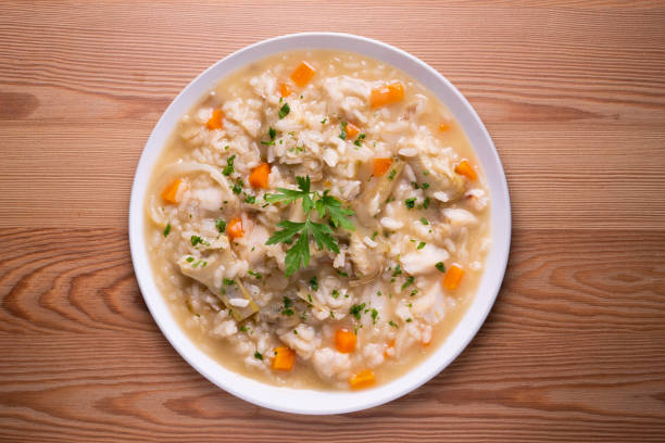 istock Soupy rice with artichokes and carrots. Typical Spanish gastronomy platter. 1424269470
