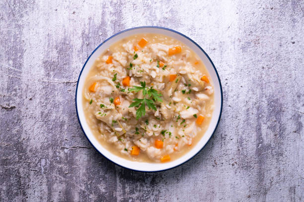 istock Soupy rice with artichokes and carrots. Typical Spanish gastronomy platter. 1424269473