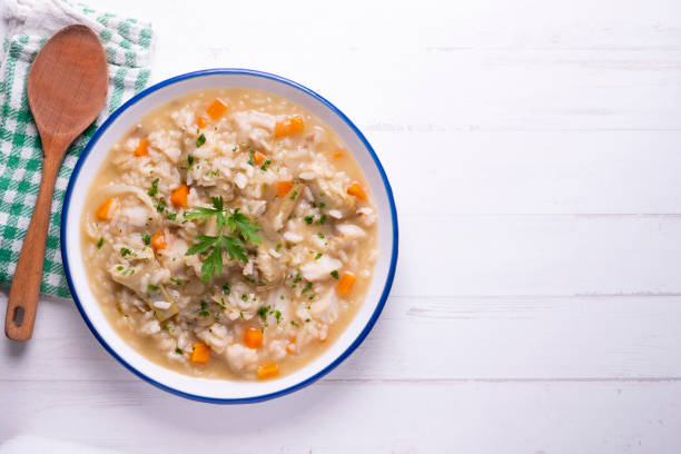 istock Soupy rice with artichokes and carrots. Typical Spanish gastronomy platter. 1424269474