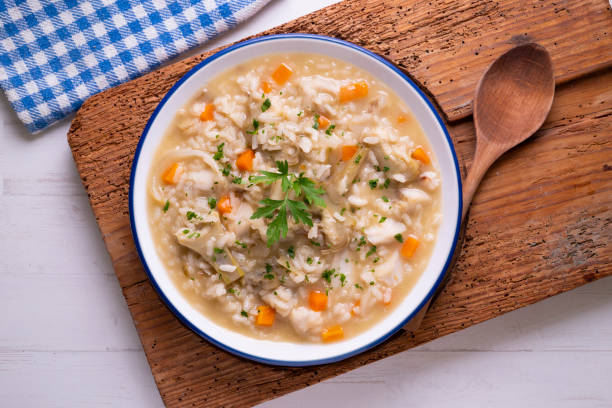 istock Soupy rice with artichokes and carrots. Typical Spanish gastronomy platter. 1424269502