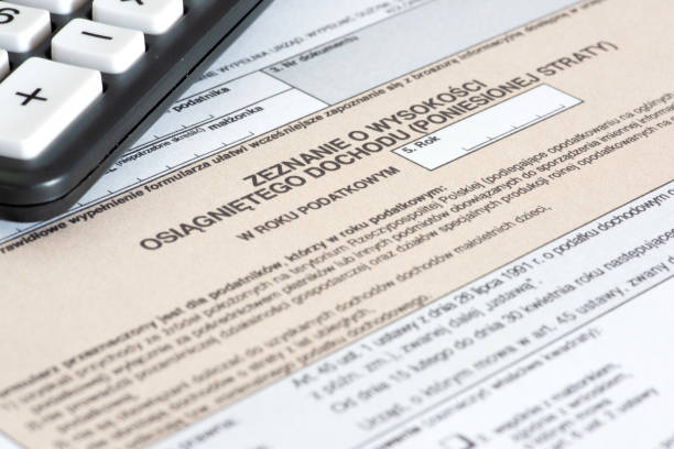 istock Form tax return in Poland and a calculator 1424269992