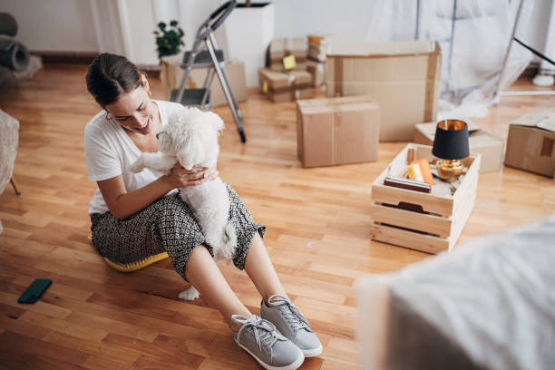 istock Woman playing with her dog 1424272717