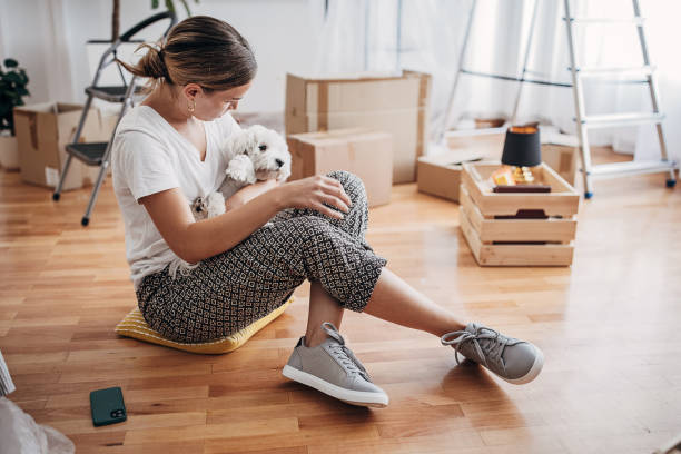istock Woman playing with her dog 1424272750