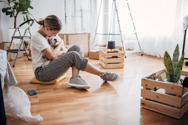 istock Woman playing with her dog 1424272793