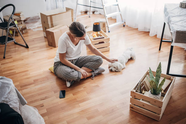 istock Woman in new home 1424273111