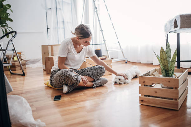 istock Woman in new home 1424273200