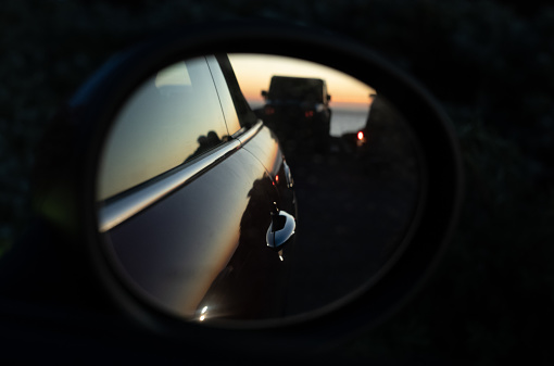 Reflection in the sideview mirror of a car