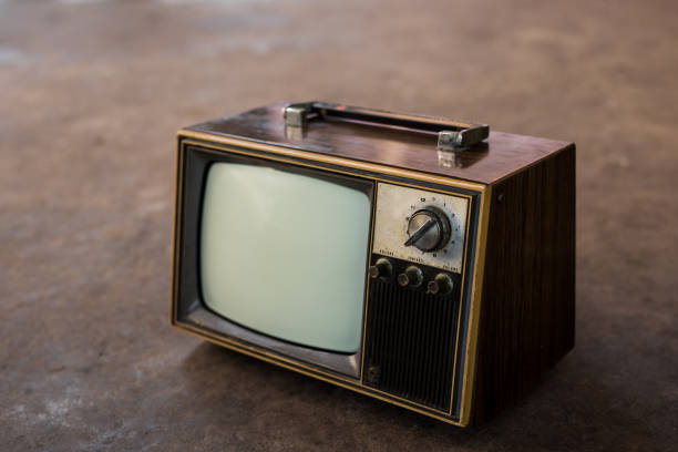 istock Old TV on cement floor background 1424274350