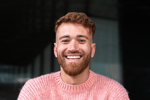 Portrait of happy man smiling in camera