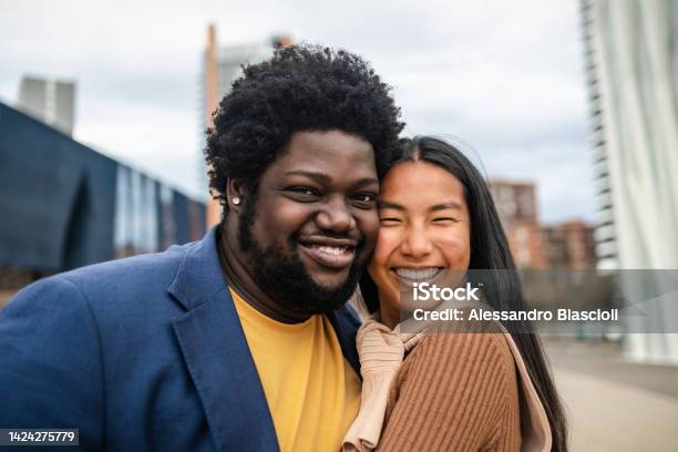 Happy Young Multiracial Friends Having Fun Hanging Out In City Stock Photo - Download Image Now