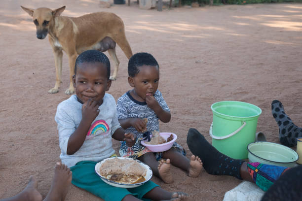 istock African children eating 1424277502