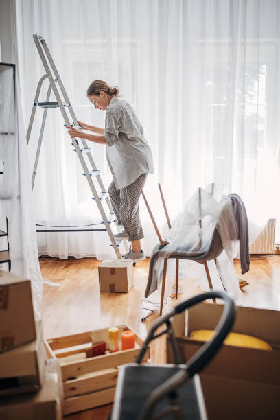 istock Woman in new home 1424287245