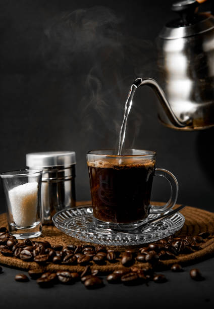 Cup of black coffee Fresh cup of coffee poured by hot water black coffee stock pictures, royalty-free photos & images