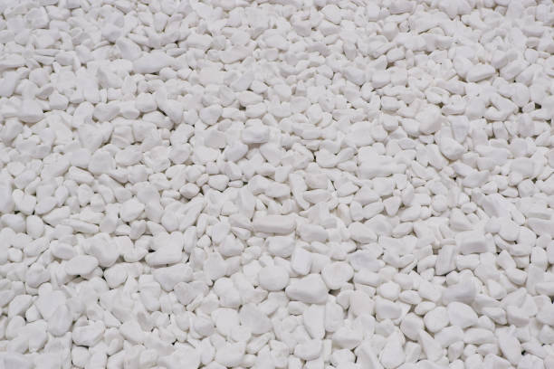 istock white river grit stones background. White marble gravel. Crushed stone texture. 1424292599