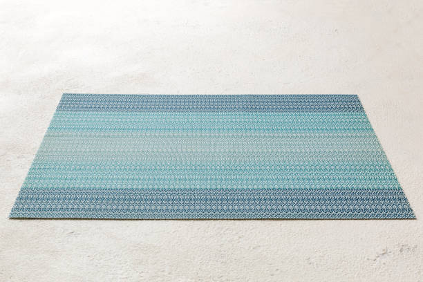istock Perspective view of blue tablecloth for food on cement background. Empty space for your design 1424295046