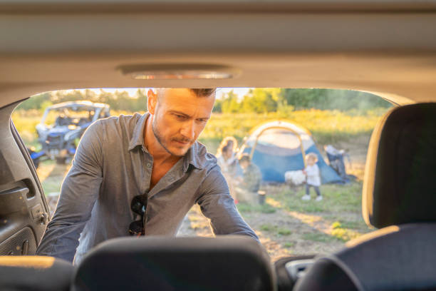 istock Unloading the Car to Set Up Camp 1424296036