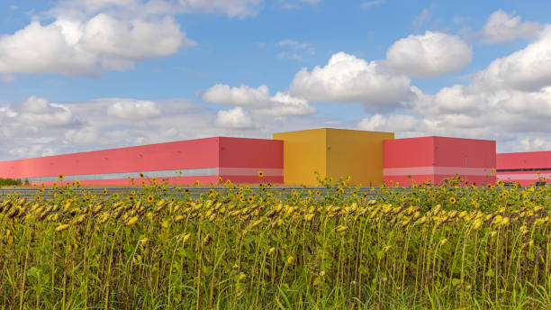istock Warehouse Buildings Sunflowers Field 1424299239