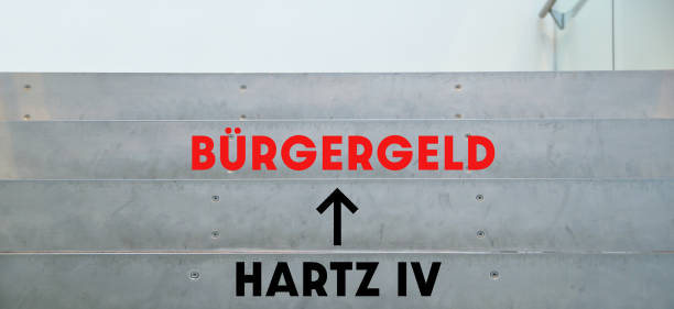 Sign arrow text Hartz IV to Buergergeld. Words at stairs office. climbing stairs to changes for the unemployed in germany. Citizens allowance, Supplementary Welfare Allowance instead of Hartz IV concept stock photo