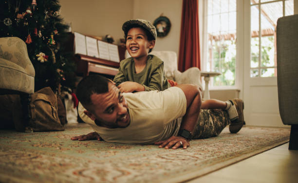 istock Army soldier spending quality time with his son at Christmas 1424301441