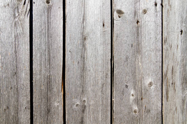 istock Old boards. The texture is wooden with deep cracks. Grunge board wall. 1424303341