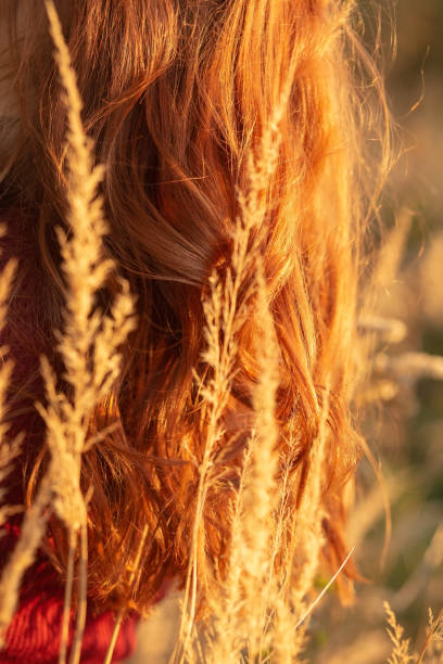 istock woman in dry grass 1424310896