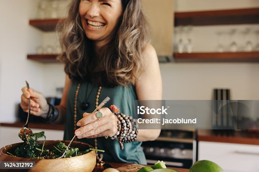 istock Digging in to a healthy vegan meal 1424312192