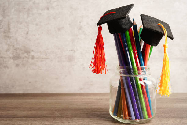 istock Graduation hat with colorful pencils on book with copy space, learning university education concept. 1424312707