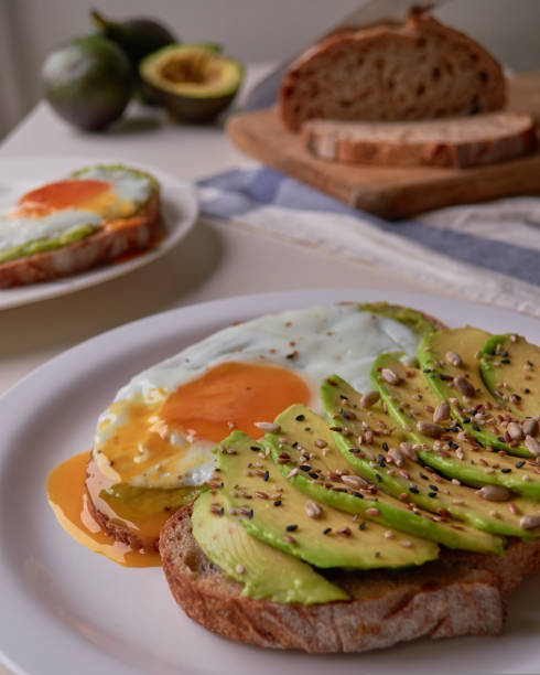 healthy breakfast with avocado and Delicious wholewheat toast. sliced avocado on toast bread with egg. Mexican cuisine