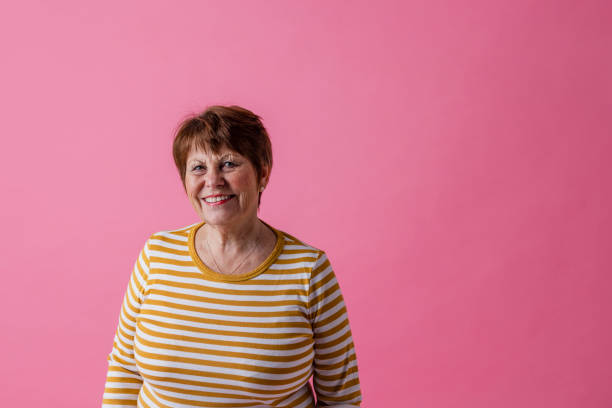 istock Happy Senior Woman Looking At Camera 1424314614