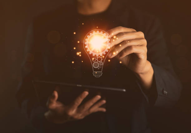 istock businessman holding a light bulb graphic Digital technology abstract. imagine an idea Creative and innovative. brain to brainstorm ideas in business. Strategies for development, growth, and success 1424315419