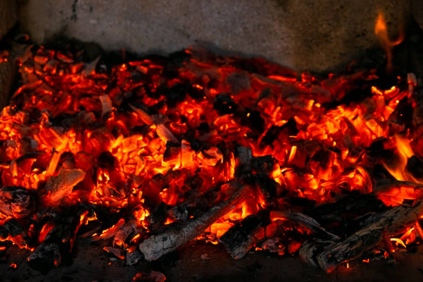 Burning coals in the fire. Wood embers burn with red fire at high temperature