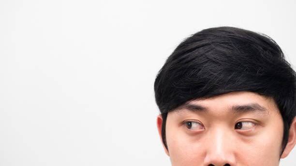 istock Close up face asian man head shot looking at space white background copy space 1424326904