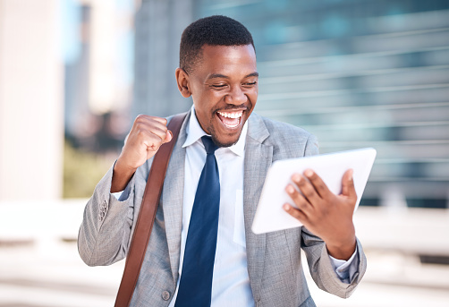 Businessman, success and digital tablet of a happy employee streaming entertainment with 5G, internet and fast speed outdoors. Black male in happiness or celebration for connection with technology.