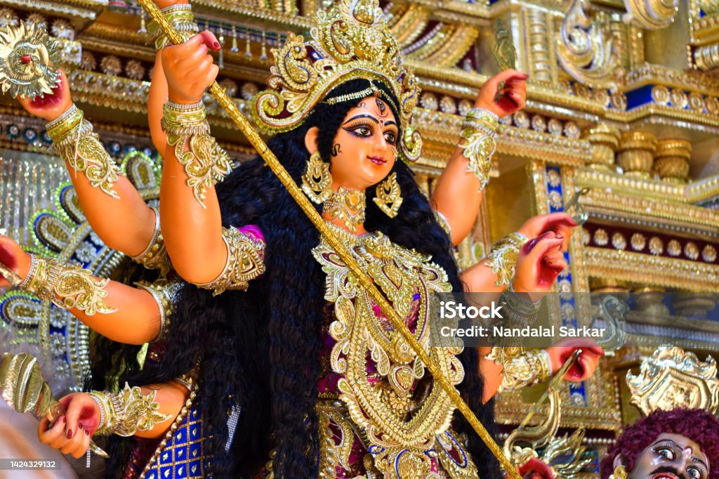 happy Durga puja advertisement, Kolkata durga puja, Navaratri, Dussehra celebration The Supreme shakti, Maa Durga is worshiped with diya lamp in utmost devotion in Hindu religion. Durga idol of kolkata durga puja festival Navratri Stock Photo