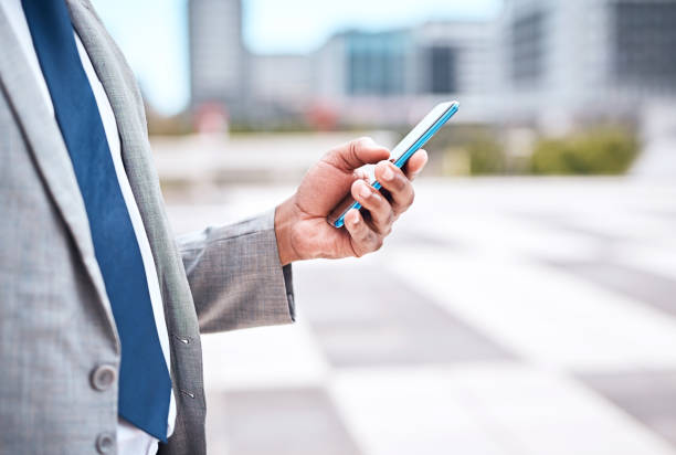 istock Phone, 5g internet and business man in the city using technology with mock up space. Digital, web and social media content scroll of a corporate lawyer employee after work with mockup in a urban town 1424330076