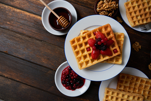 Sweet Homemade Belgian Waffle with Berry and vegan oat milk