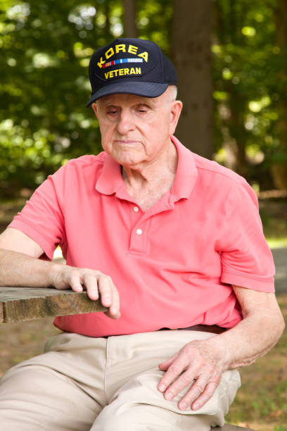 istock Korean War Veteran outdoors contemplating 1424334056