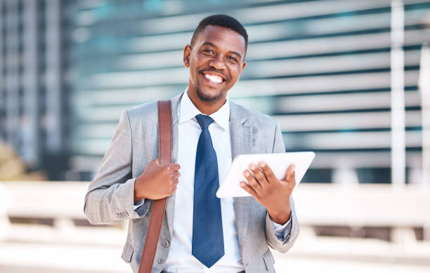 istock Business man working on tablet in city, planning schedule with 5g tech and reading email in morning. Face portrait of employee, worker and manager networking online and in communication with people 1424336327